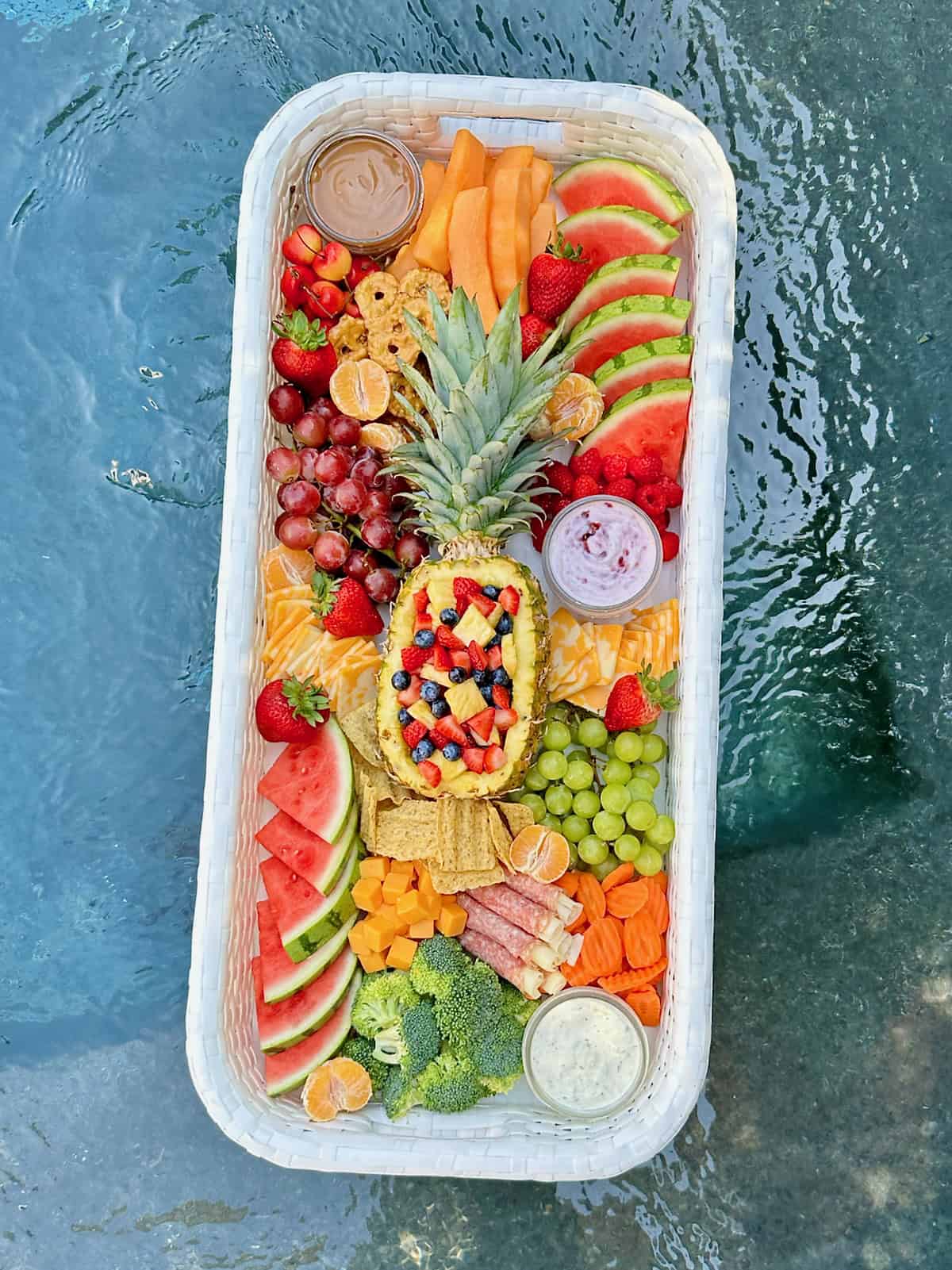 Close up shot of a snack tray floating in a pool.